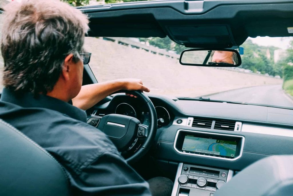 Man Driving Car Purchased With A Used Car Loan